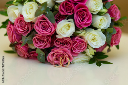 Wedding rings with wedding bouquet