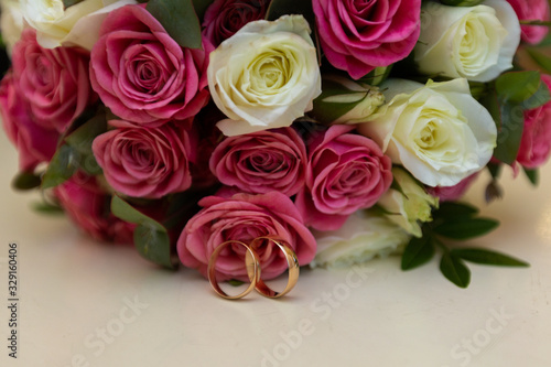 Wedding rings with wedding bouquet