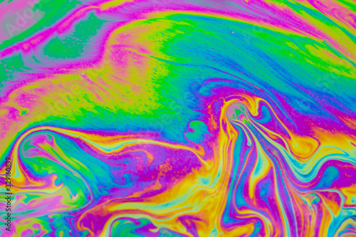 Psychedelic abstract background. Photo macro shot with light interference on the surface of a soap bubble