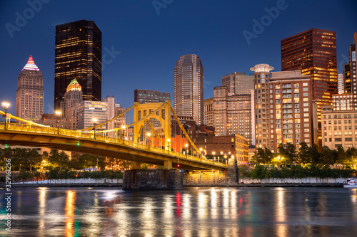 Fototapeta Naklejka Na Ścianę i Meble -  City skyline view over the Allegheny River and Roberto Clemente Bridge in downtown Pittsburgh Pennsylvania USA