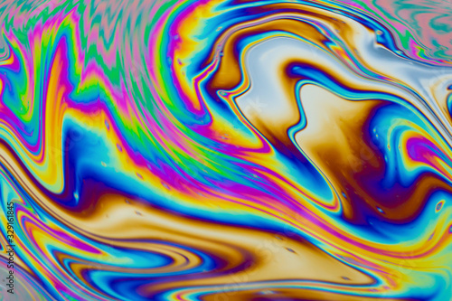 Psychedelic multicolored patterns background. Photo macro shot of soap bubbles