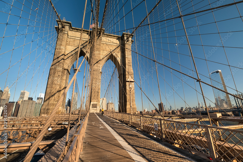 Fototapeta premium Pedestrian path over the Brooklyn Bridge connecting Manhattan New York City over the East River