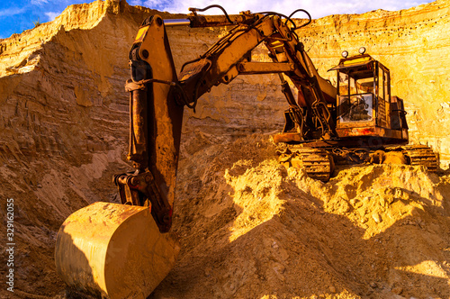 Sand mining concept - quarry sand excavator with heavy machinery -  Construction industry - Old rusty bulldozer machine at break