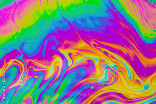 Psychedelic multicolored patterns background. Photo macro shot of soap bubbles © Achira22