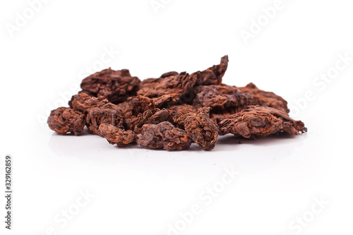 Dried puer tea heap isolated on a white background.