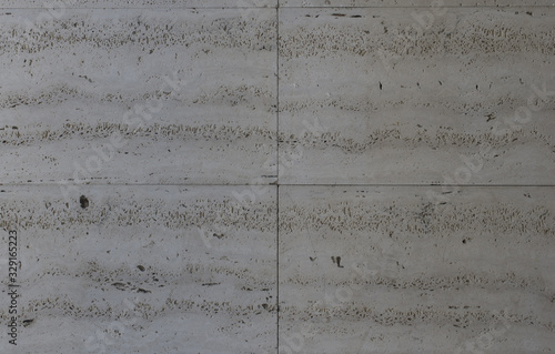 Eroded gray wall with slab shape
