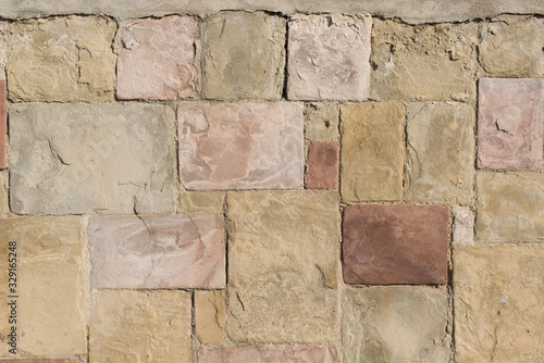 Wall made with large brown-yellow stones