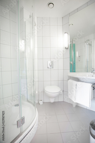 Interior of stylish and elegant bathroom in hotel. Private apartment. Water relaxation treatments and spa at home. Minimalistic design in light shades