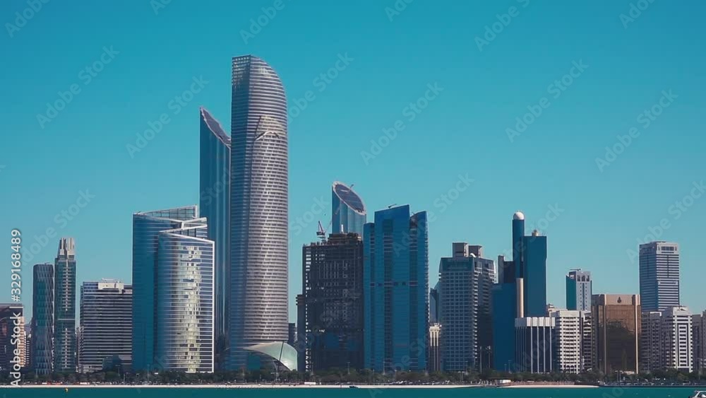 View of Abu Dhabi Cityscape on Sunny Day with Clear Blue Sky View of Abu Dhabi Cityscape on Sunny Day with Clear Blue Sky