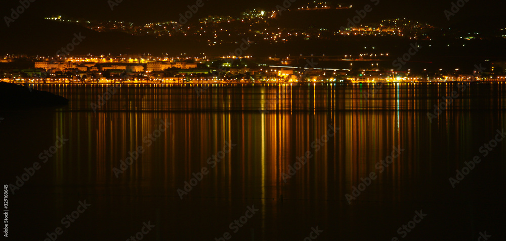 lights reflected in the sea water
