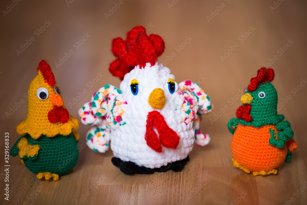Symbol of the year 2017, the year of the rooster. Knitted cock, isolate. Textile decoration for interior design or Christmas tree. Perfect for a gift.
