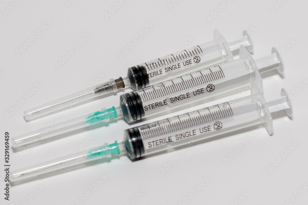 several syringes on the white background several syringes on the white background