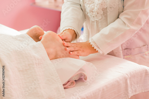 Foot massage therapy, with specialized professional