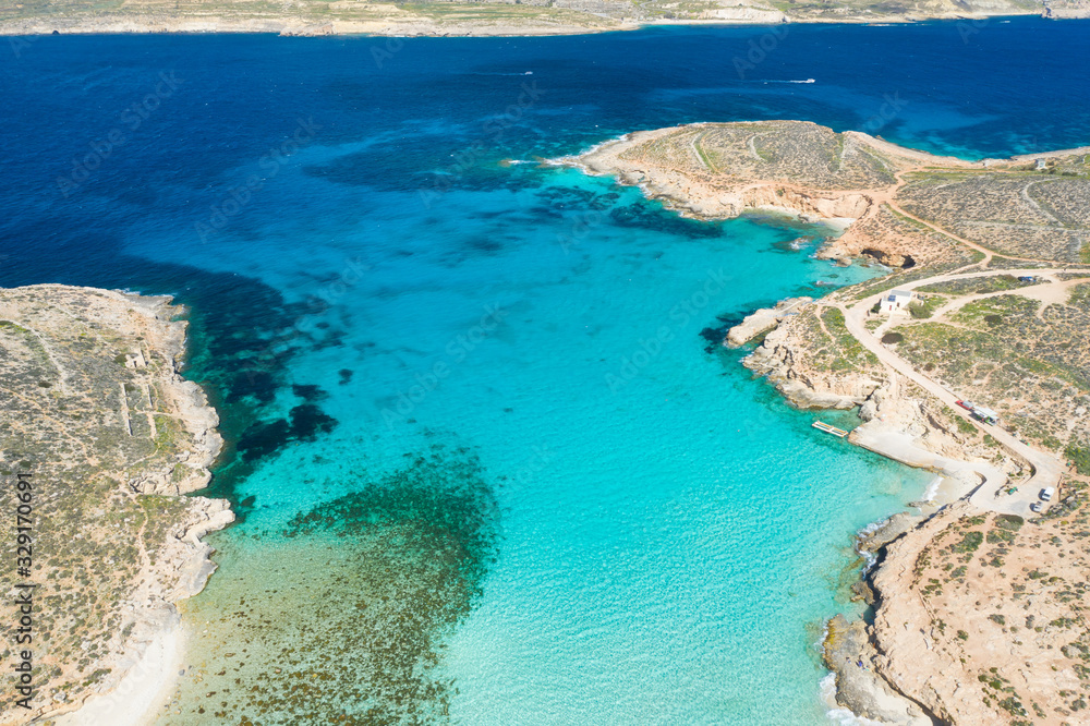 Aerial drone photo - The famous Blue Lagoon in the Mediterranean Sea. Comino Island, Malta.