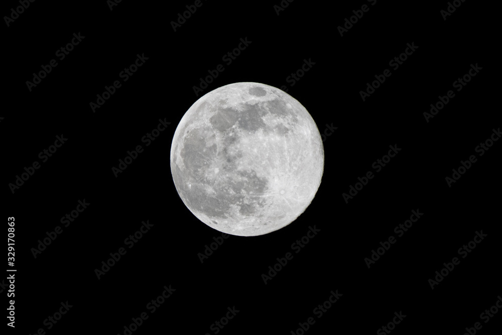 in the night sky the full moon shines in the night sky the full moon shines