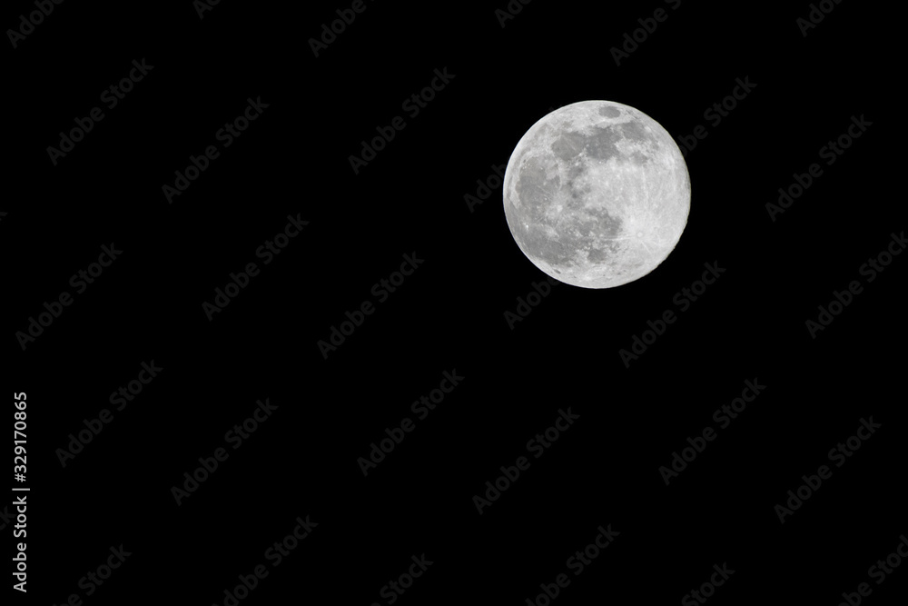in the night sky the full moon shines in the night sky the full moon shines