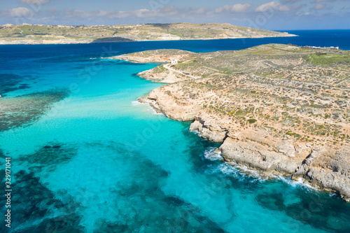 Aerial drone photo - The famous Blue Lagoon in the Mediterranean Sea. Comino Island, Malta.