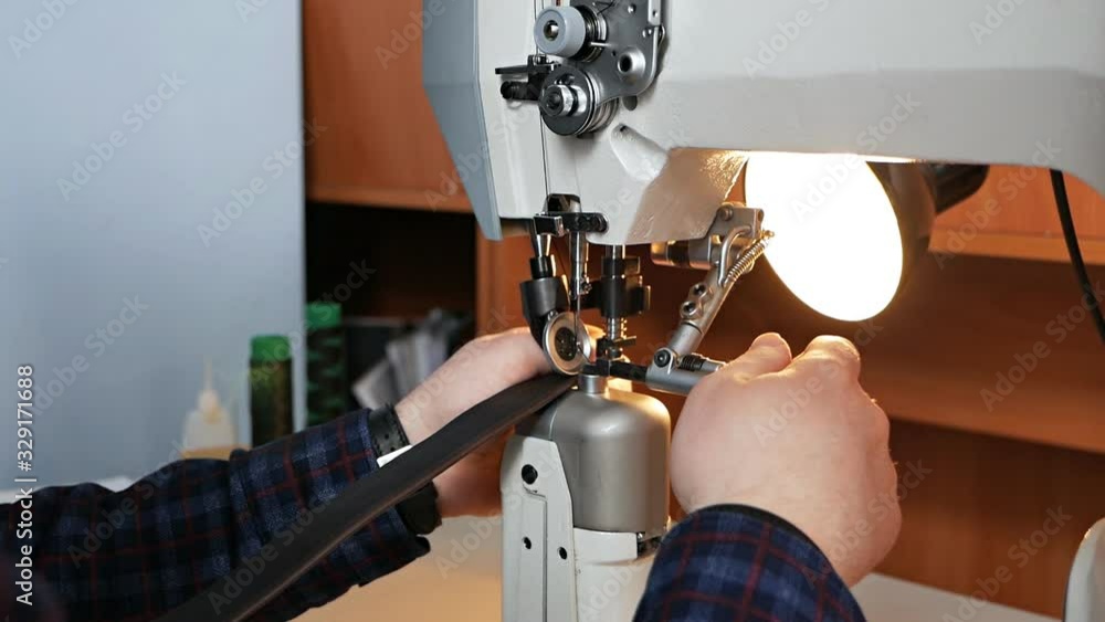 Stockvideon Sewing machine needle in motion. A closeup of the needle