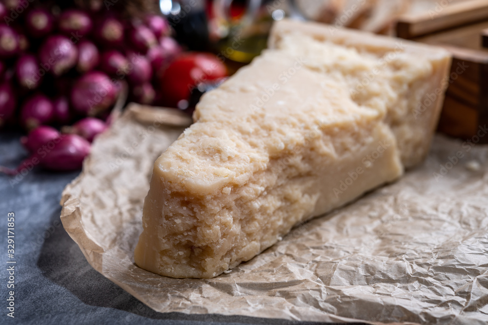 One piece of authentic Parmigiano-Reggiano or Parmesan Italian hard, granular cheese