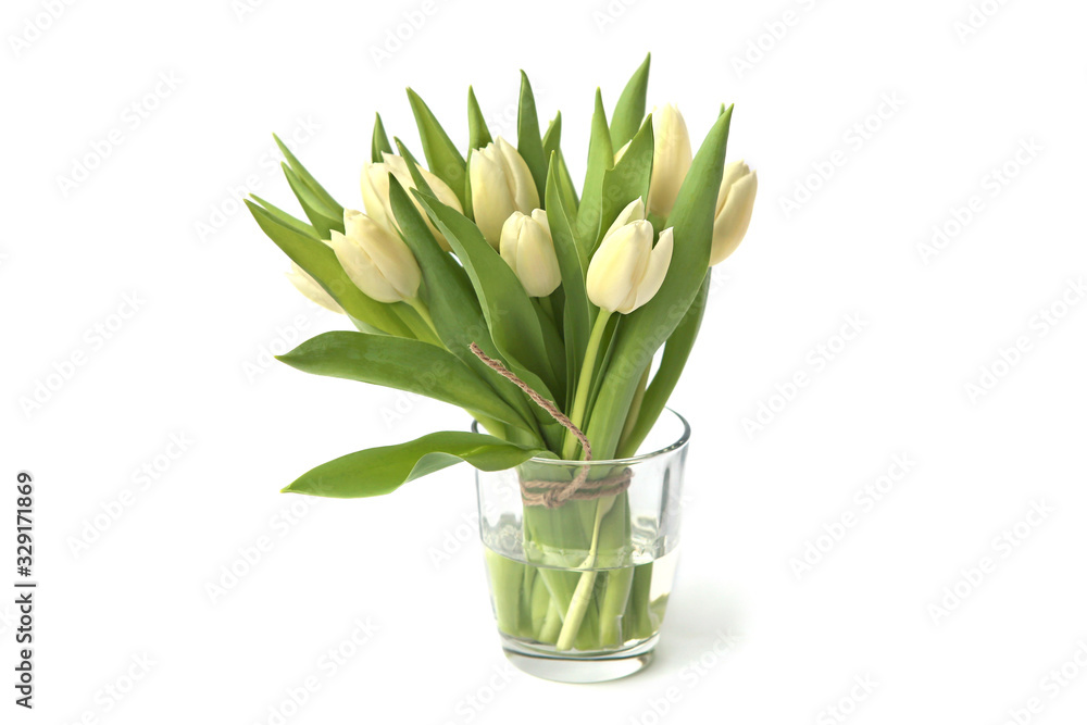 White tulips bouquet in glass vase isolated on white background. Spring bouquet of fresh tulip flowers.. White tulips bouquet in glass vase isolated on white background. Spring bouquet of fresh tulip flowers..