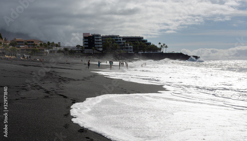 Black lava sand beach in Puerto Naos, La Palma, Canarian islands, Spain photo