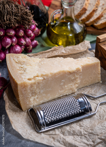 One piece of authentic Parmigiano-Reggiano or Parmesan Italian hard, granular cheese