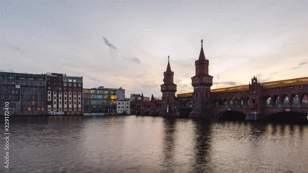Day to Night Time Lapse of Berlin Oberbaumbruecke with Spree River, Berlin, Germany Day to Night Time Lapse of Berlin Oberbaumbruecke with Spree River, Berlin, Germany