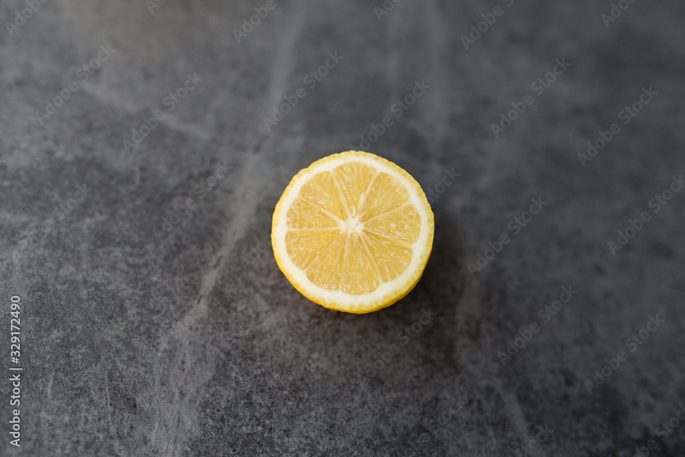 yellow lemon cutaway on a gray background yellow lemon cutaway on a gray background
