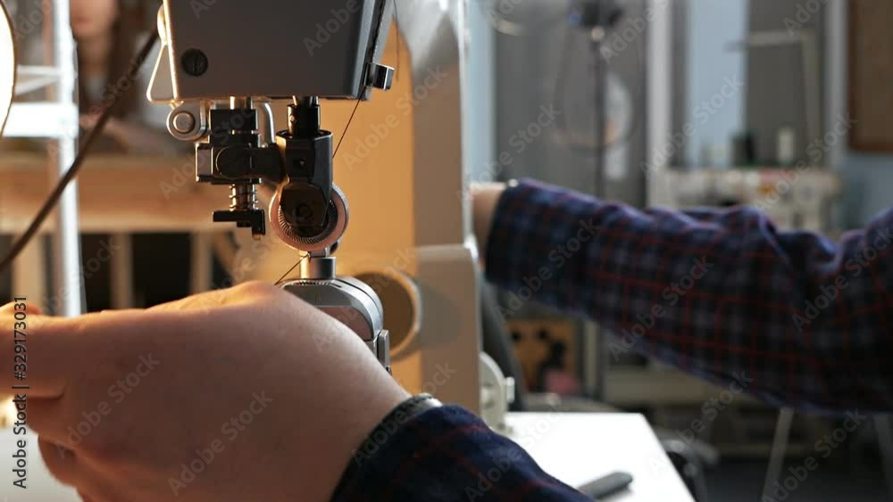 Sewing machine needle in motion. A closeup of the needle of a sewing
