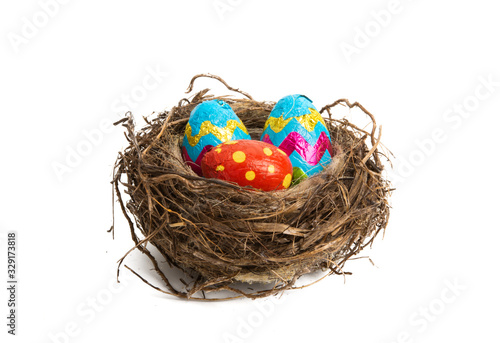 nest with chocolate eggs isolated