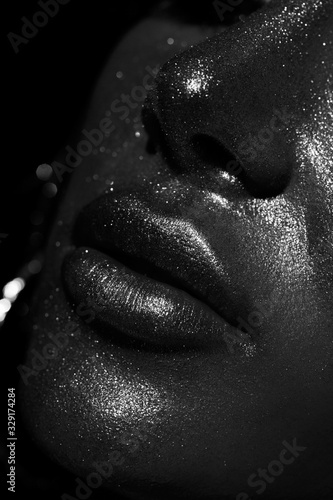 female lips with glitter and spangle (shallow DOF)