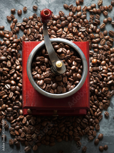 coffee grinder beans on concrete background
