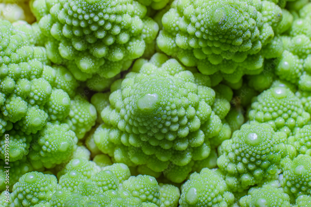 Green Romanesco broccoli. macro photo. Natural fractal patterns Green Romanesco broccoli. macro photo. Natural fractal patterns