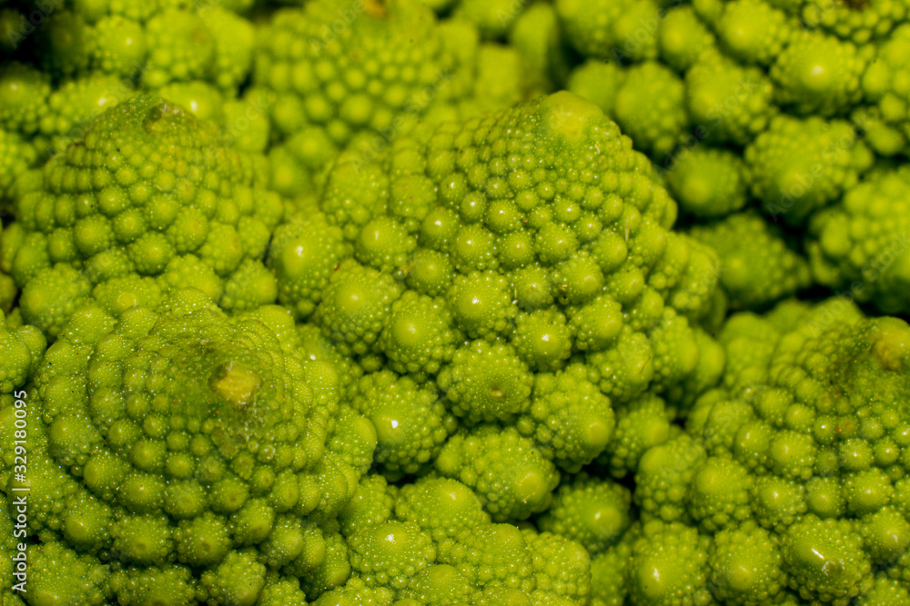 Green Romanesco broccoli. macro photo. Natural fractal patterns Green Romanesco broccoli. macro photo. Natural fractal patterns