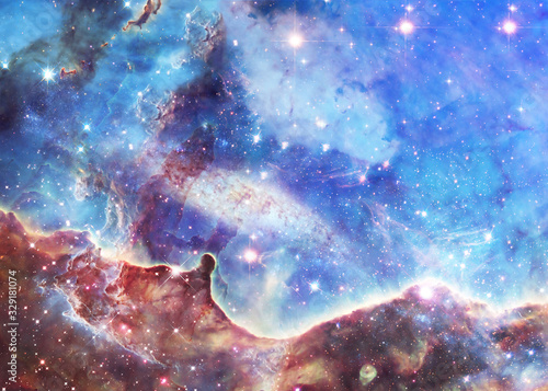 Stardust in deep space. Star forming region. Science fiction wallpaper. Elements of this image were furnished by NASA.