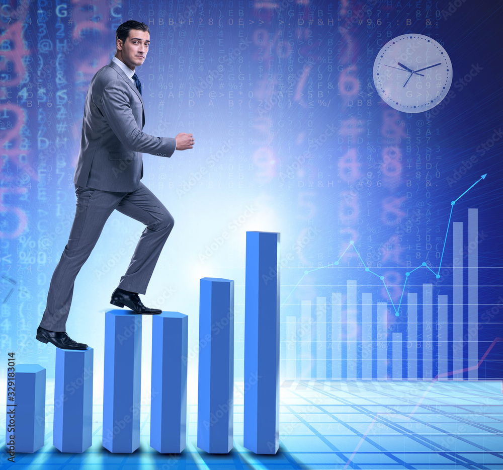 Businessman climbing bar charts in business concept Businessman climbing bar charts in business concept