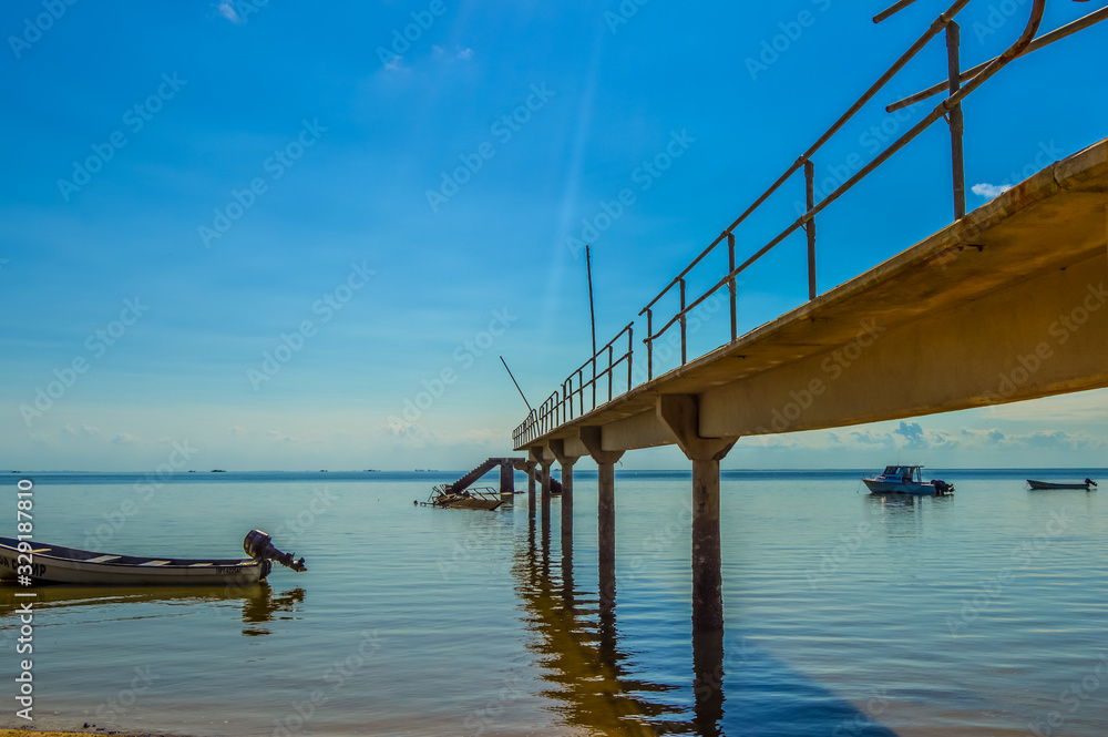 Beautiful bridge and pier at Inhaca or Inyaka Island near Portuguese Island in Maputo Mozambique under blue sky Beautiful bridge and pier at Inhaca or Inyaka Island near Portuguese Island in Maputo Mozambique under blue sky