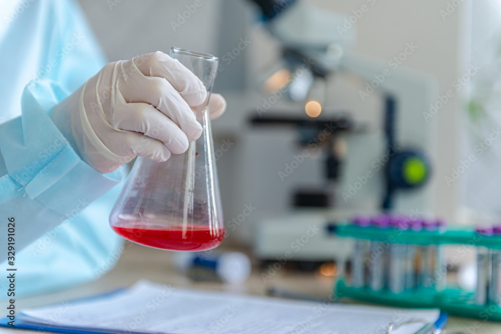 A doctor is looking for a coronavirus vaccine in his laboratory. A doctor is looking for a coronavirus vaccine in his laboratory.