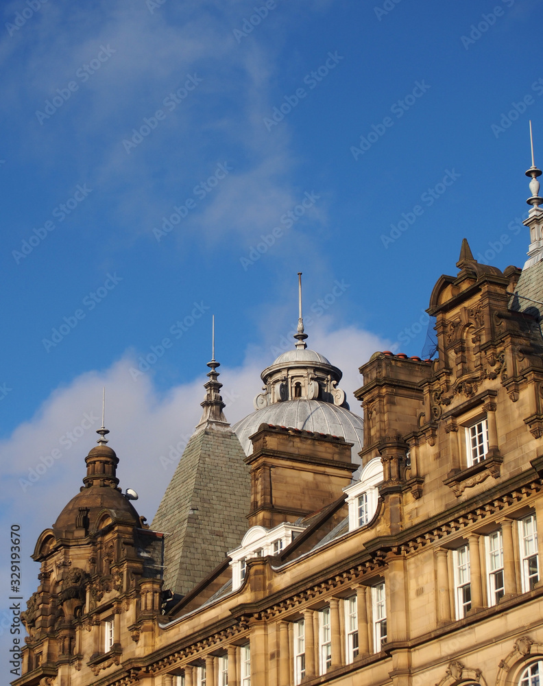ornate stone towers and domes on the roof of leeds city market a historical building in west yorkshire england ornate stone towers and domes on the roof of leeds city market a historical building in west yorkshire england