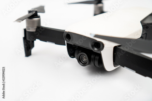 White drone quadcopter isolated above white background