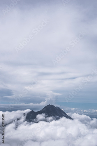 Mountain surrounded by thick clouds