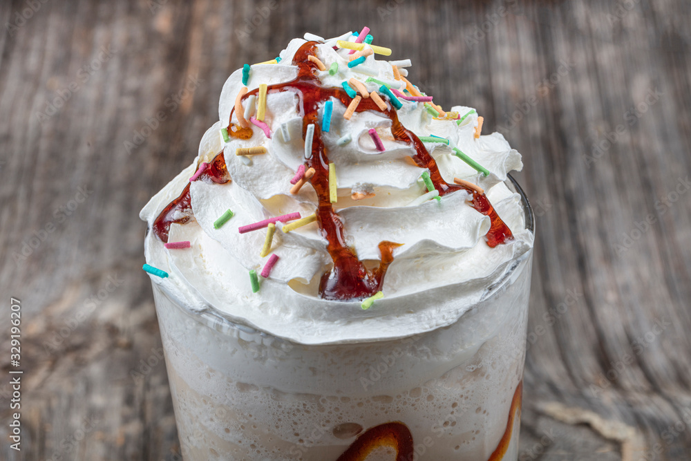 Chocolate Milk and Whipped Cream on wooden floor. Stock Photo Adobe Stock