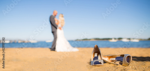 beach wedding with heels in sand
