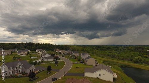 Aerial view of storm clouds over neighborhood