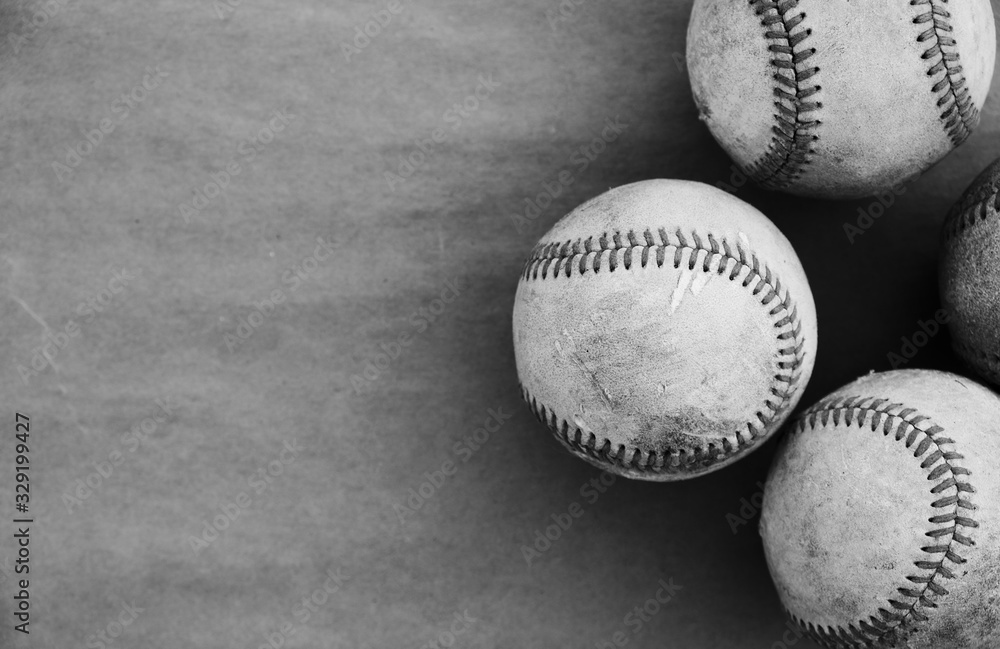 Black and white baseballs on old texture background. Black and white baseballs on old texture background.