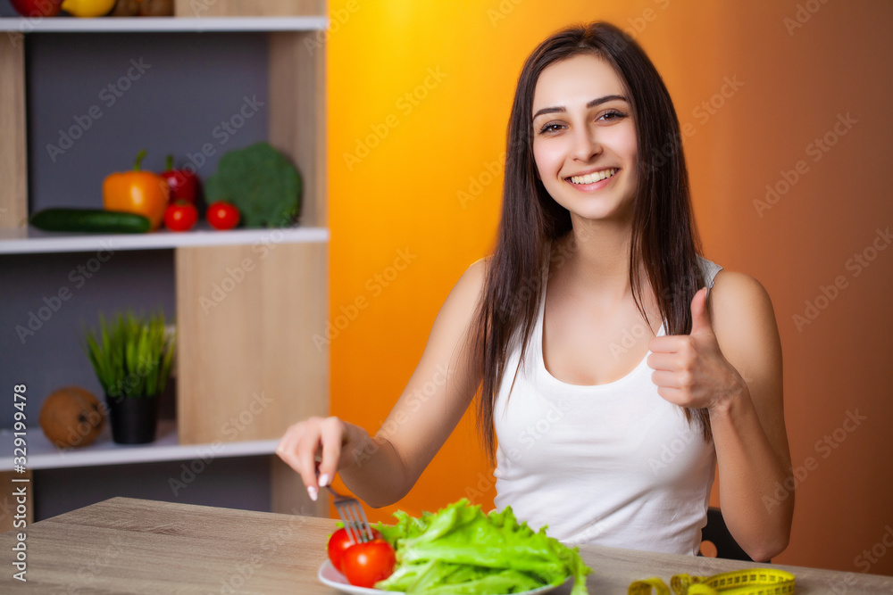 Portrait of young beautiful girl adhering to diet regime