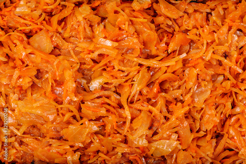 Stewed cabbage with carrots, onions and tomato sauce. Texture