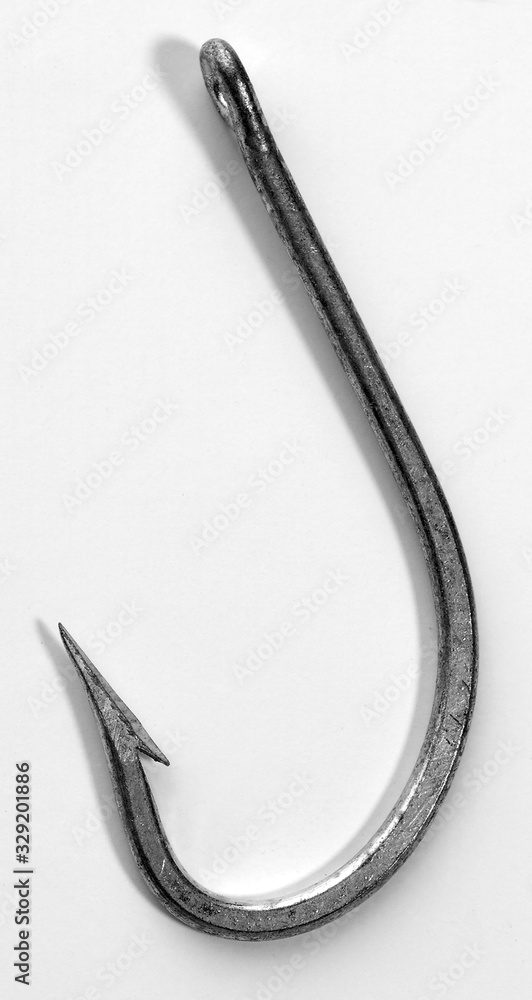 A very closeup shot of a fishing hook on a white background