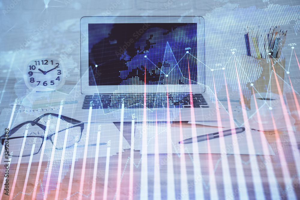 Forex market chart hologram and personal computer background. Multi exposure. Concept of investment. Forex market chart hologram and personal computer background. Multi exposure. Concept of investment.