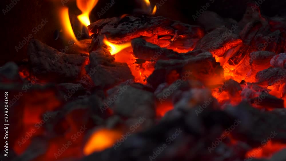 Close up view of burning coals with fire, Glowing Charcoal Background Close up view of burning coals with fire, Glowing Charcoal Background